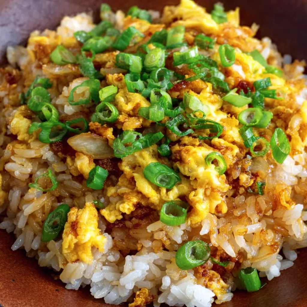 Authentic hibachi fried rice with grilled chicken and vegetables.