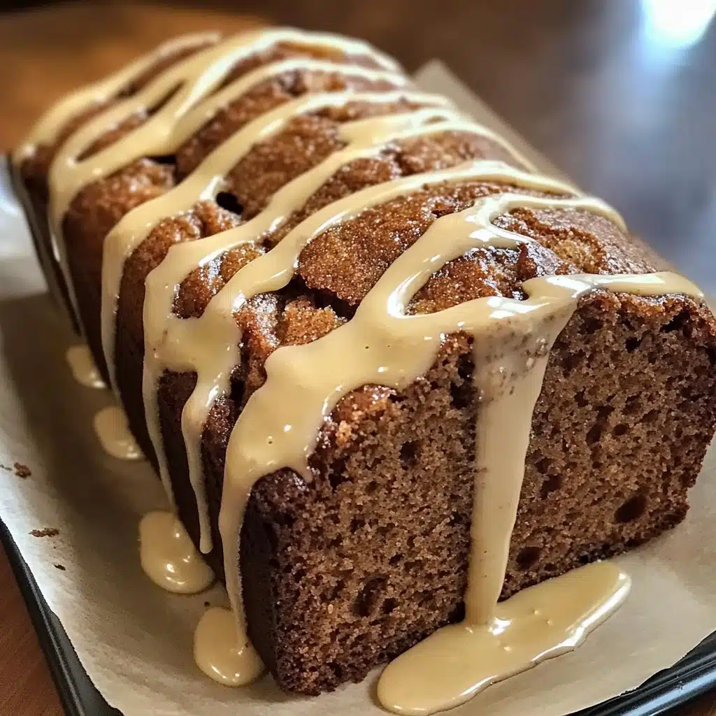 Gingerbread loaf slice with creamy vanilla drizzle