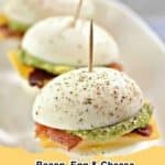 Close-up of golden brown Bacon, Egg & Cheese Sliders with melted cheese and crispy bacon, ready to serve on a rustic wooden board.