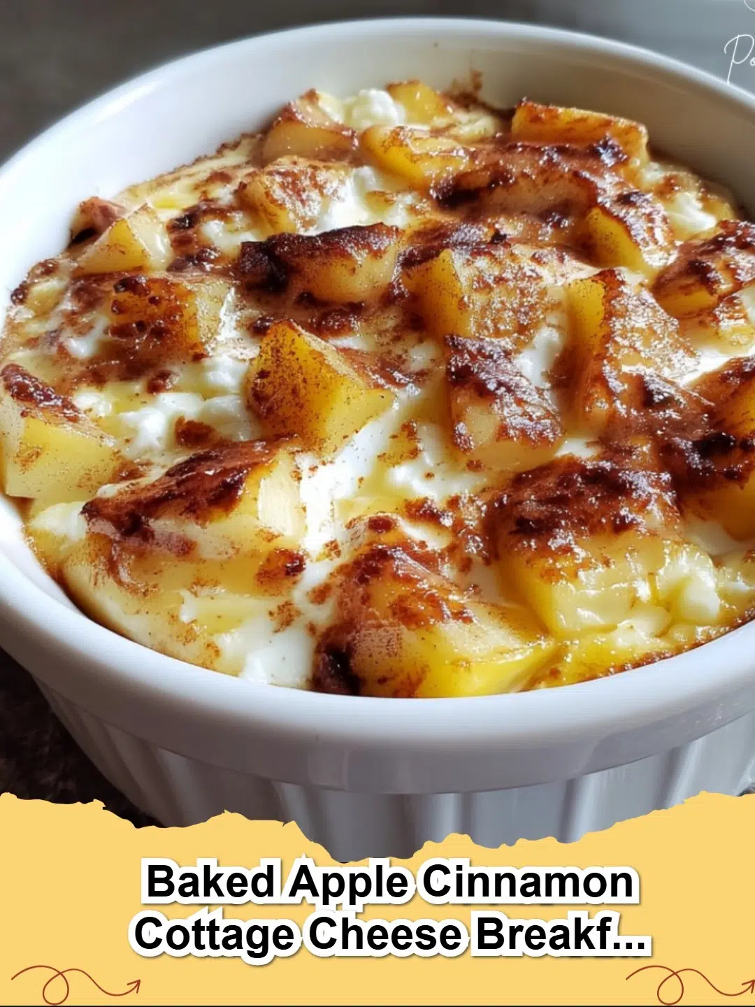 Two golden brown Baked Apple Cinnamon Cottage Cheese Breakfast Bowls, garnished with fresh apple slices and a sprinkle of cinnamon.