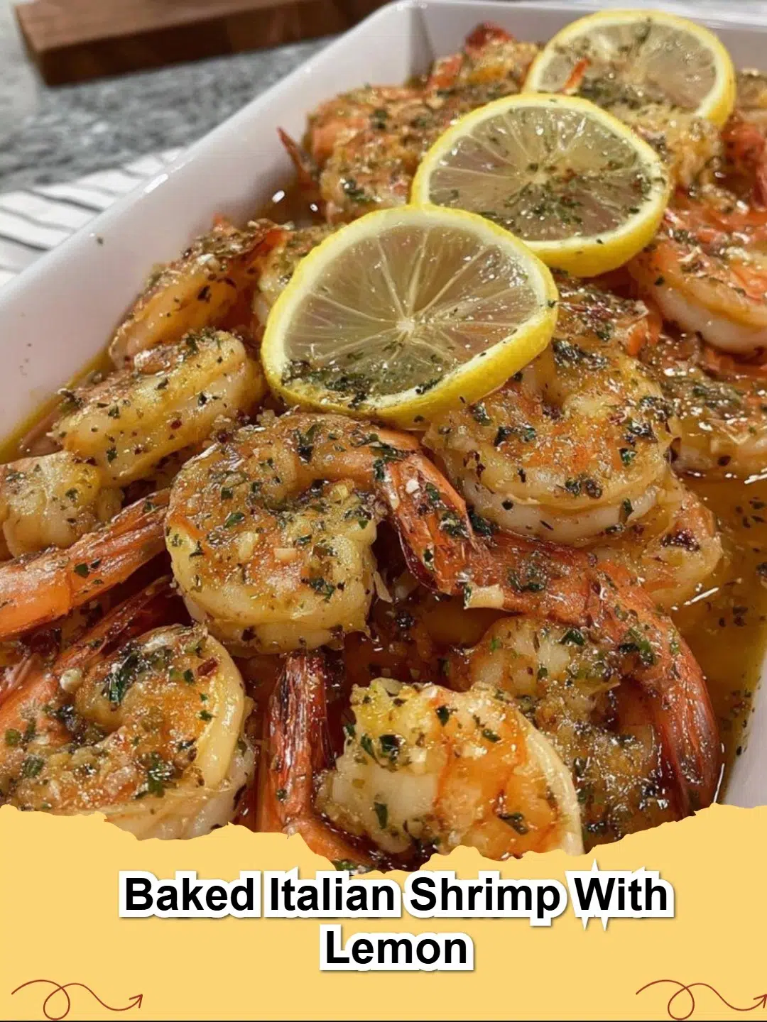 Platter of delicious Baked Italian Shrimp with Lemon, garnished with fresh parsley and lemon slices.