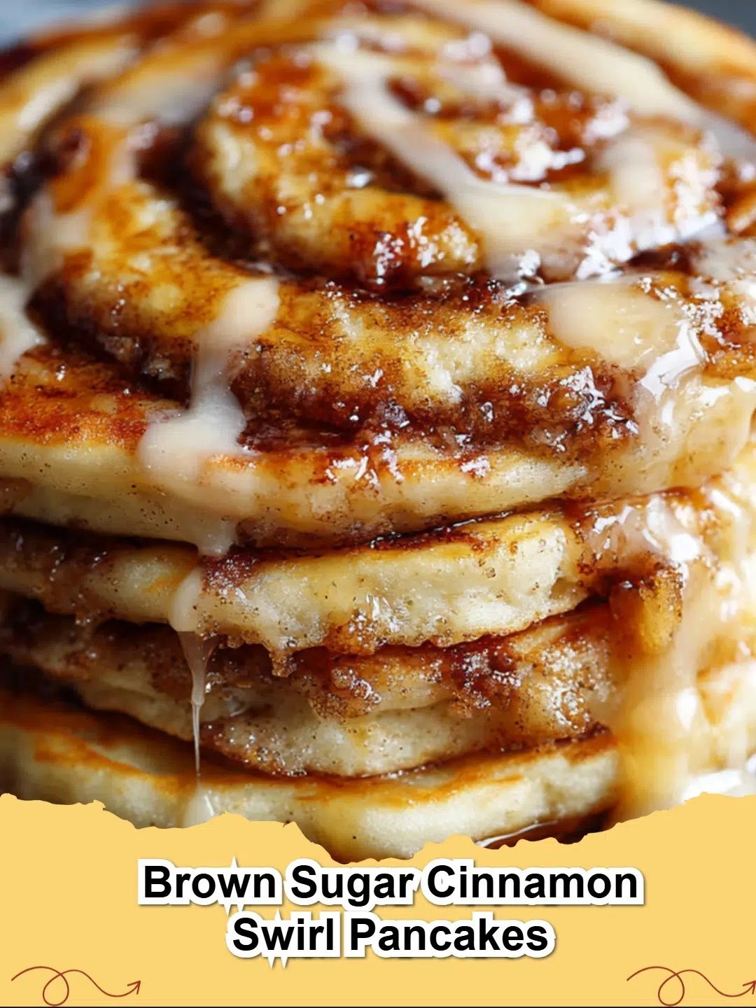 Fluffy Brown Sugar Cinnamon Swirl Pancakes stacked high with maple syrup.