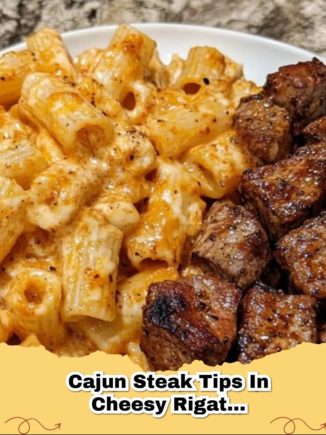 Delicious Cajun Steak Tips in Cheesy Rigatoni Parmesan Sauce served in a bowl, garnished with fresh parsley.