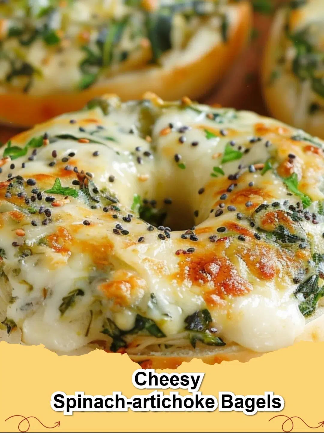 Delicious Cheesy Spinach-Artichoke Bagels on a baking sheet, ready to be served.