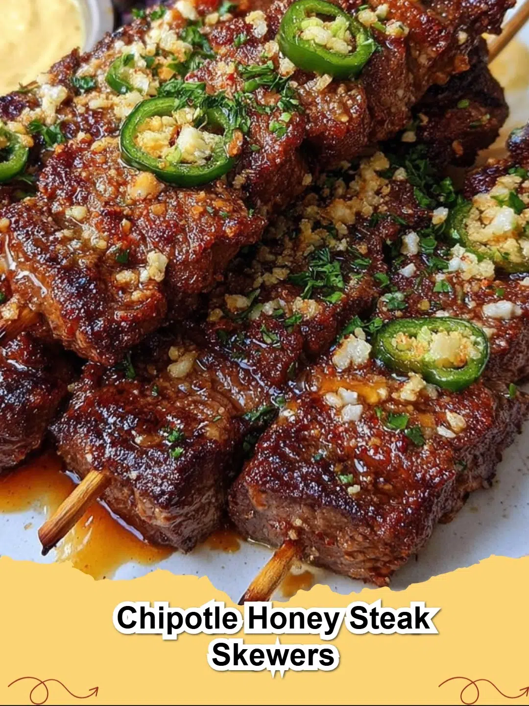 Close-up of grilled Chipotle Honey Steak Skewers with colorful bell peppers and red onion, resting on a serving platter.