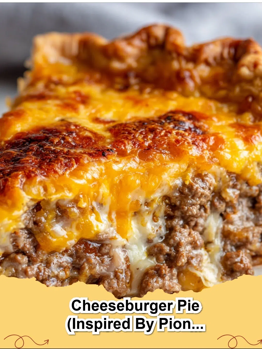 Slices of Classic Cheeseburger Pie with melted cheese and a golden crust on a rustic cutting board, garnished with fresh parsley.