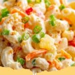 Creamy Hawaiian Macaroni Salad in a large bowl, garnished with green onions, ready to serve at a barbecue.