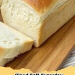 A perfectly baked loaf of Cloud Soft Everyday Bread with a golden crust, sliced on a cutting board, ready to be enjoyed.