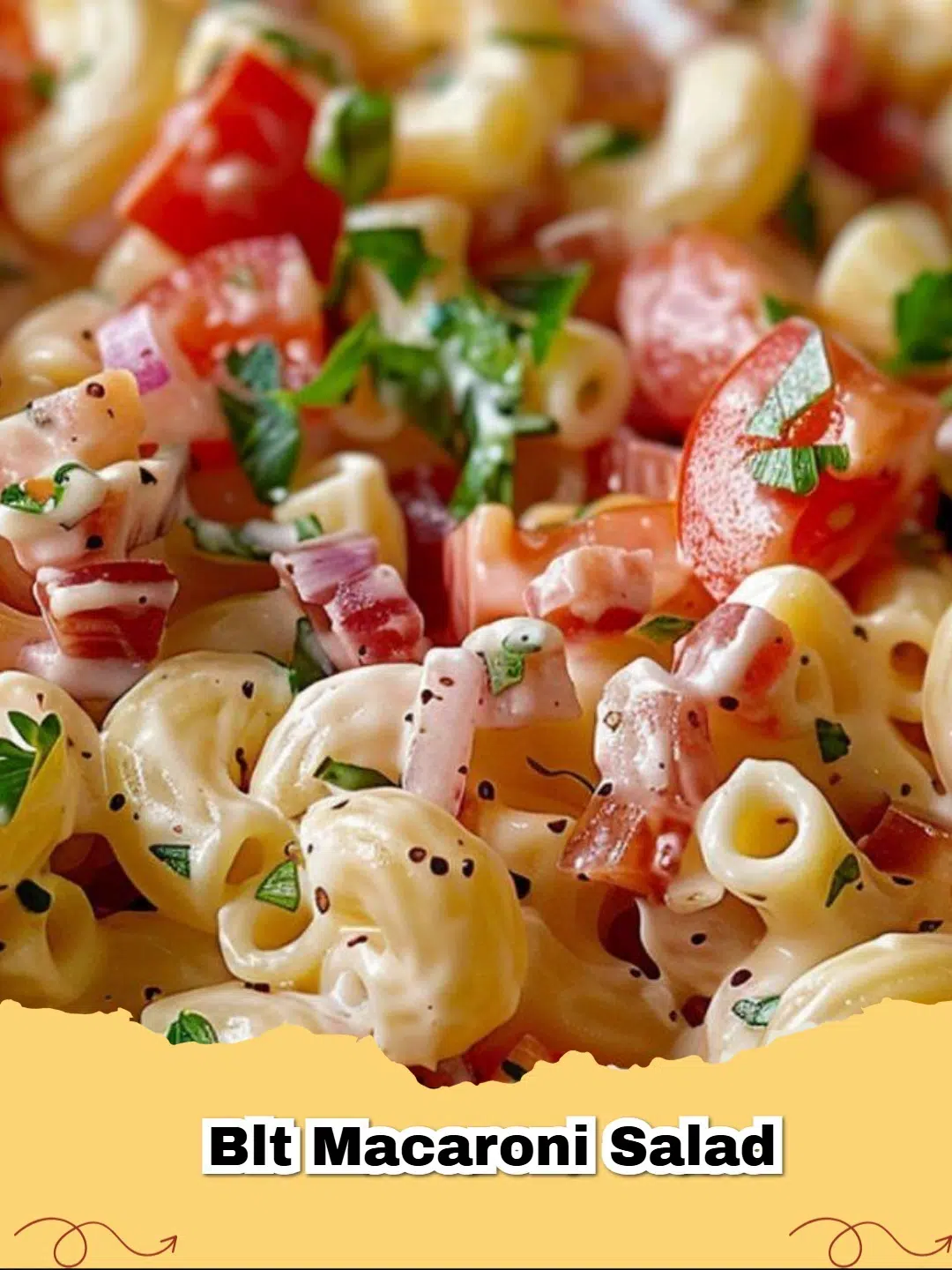 Creamy BLT Macaroni Salad in a serving bowl, garnished with extra bacon and tomatoes
