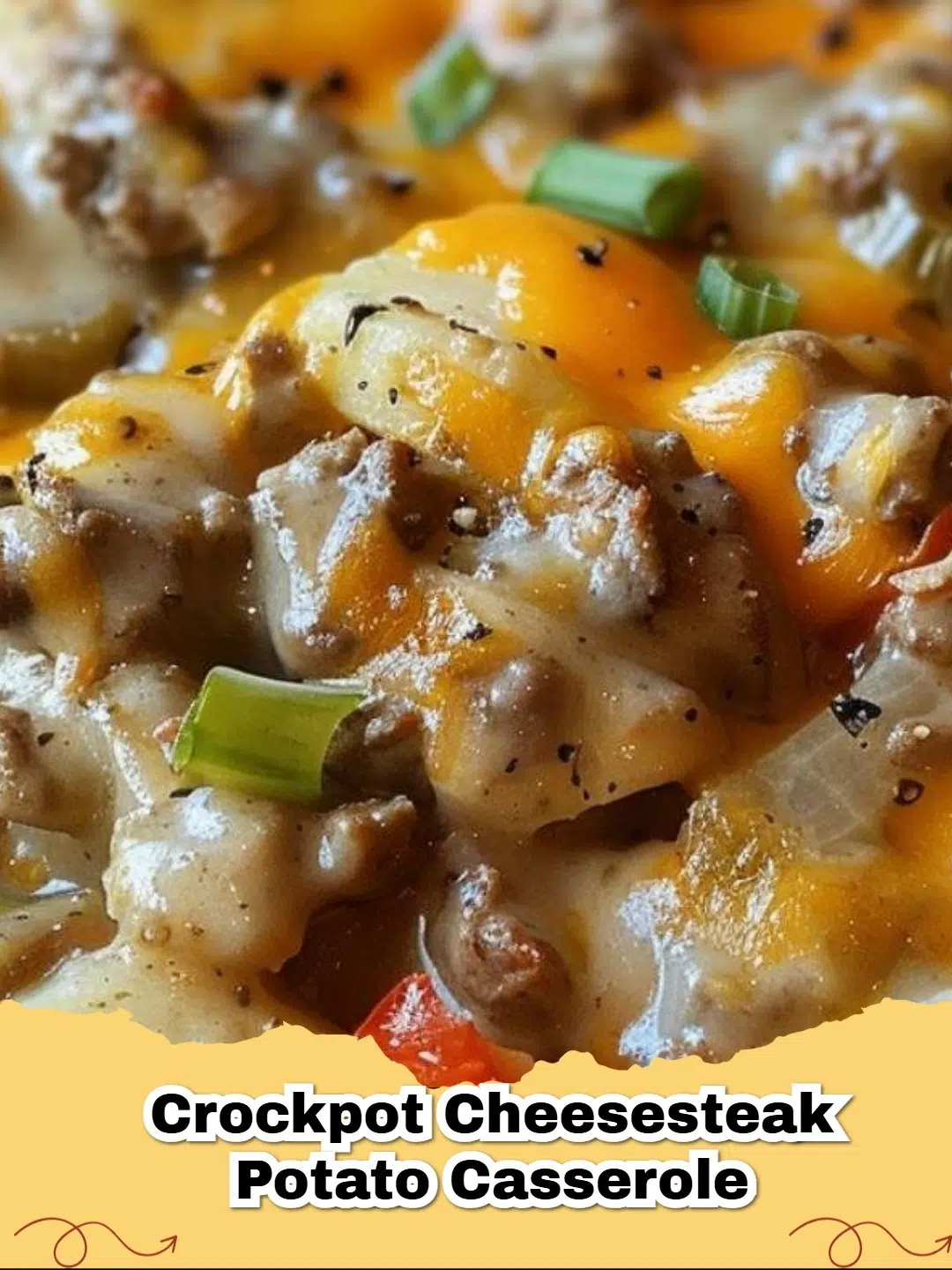 A close-up of a bubbling Crockpot Cheesesteak Potato Casserole with melted cheese, ground beef, and vegetables.