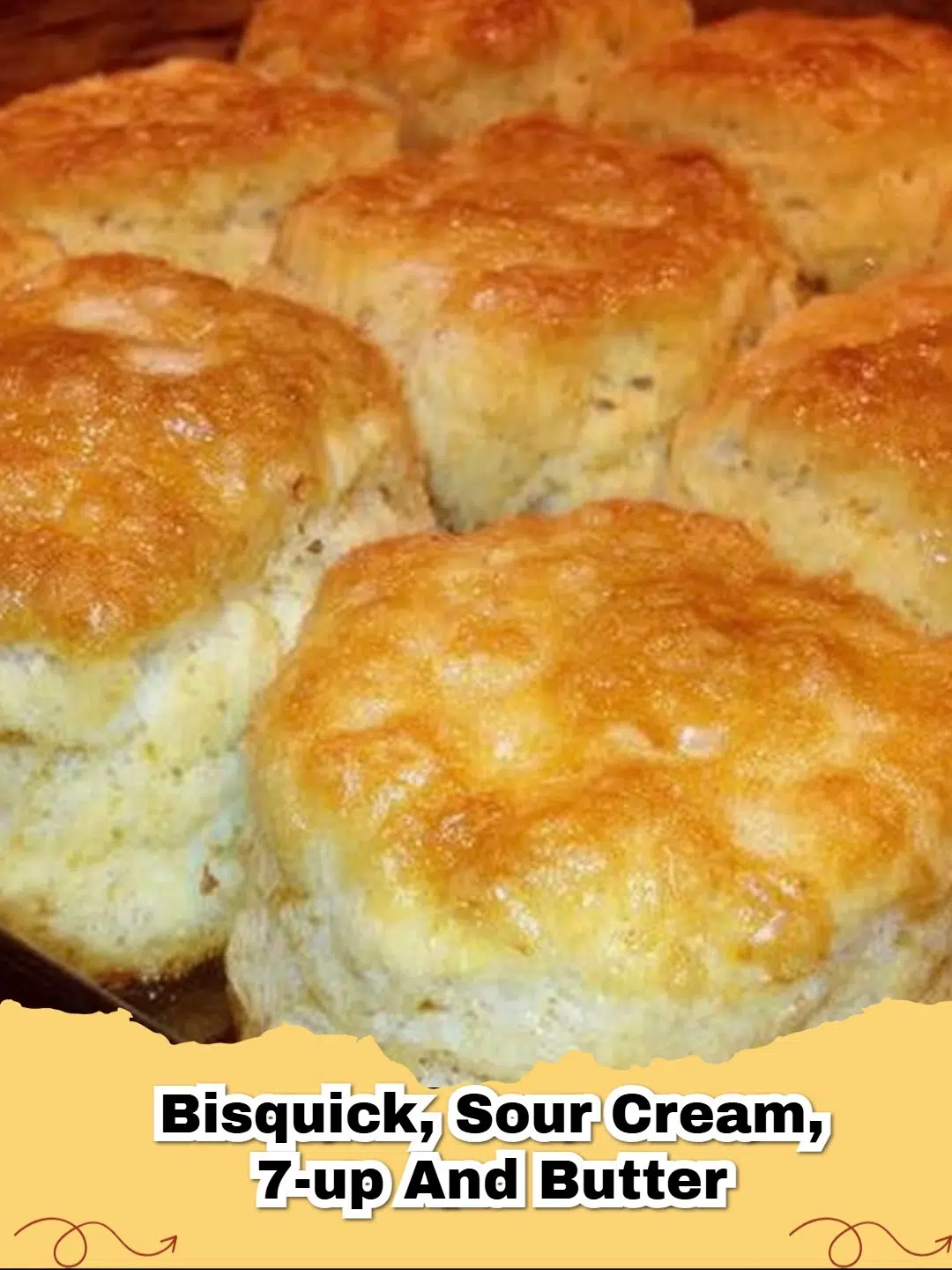 Golden brown, fluffy Easy 7 Up Biscuits stacked on a plate with butter, fresh from the oven