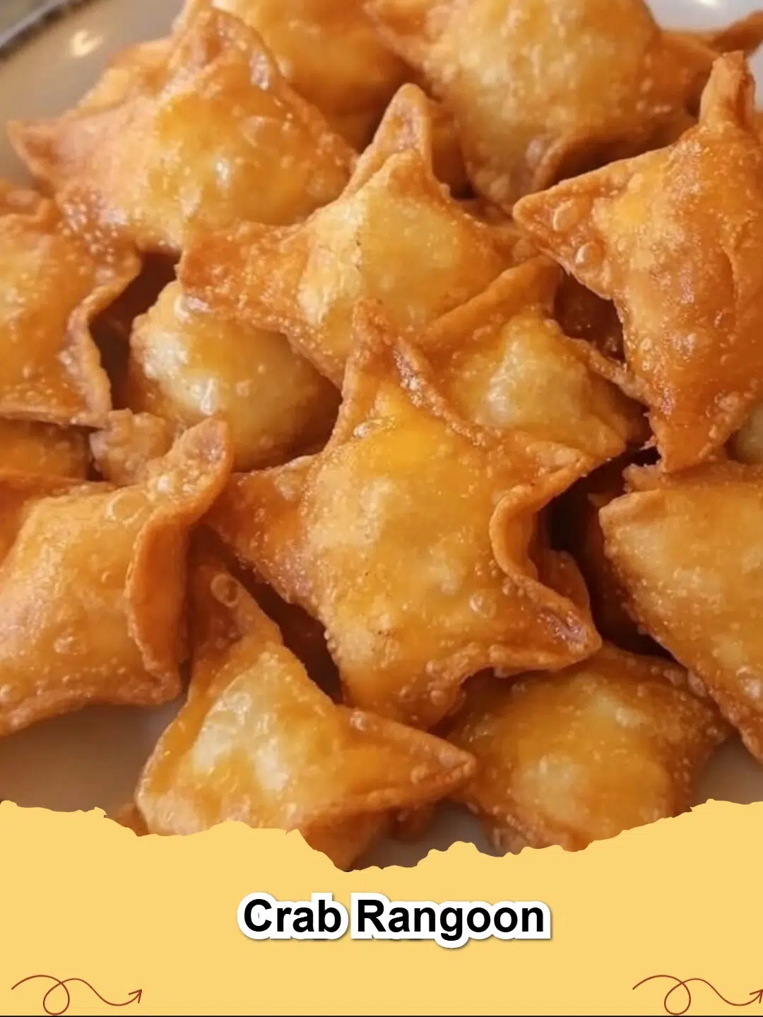 Crispy golden brown homemade Crab Rangoon appetizers arranged on a platter with dipping sauce