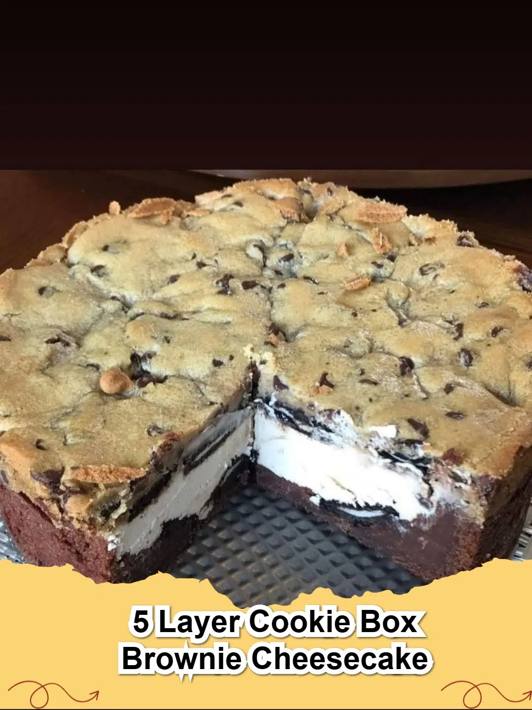 Slice of Five Layer Cookie Brownie Cheesecake showing distinct layers, topped with whipped cream and chocolate shavings.