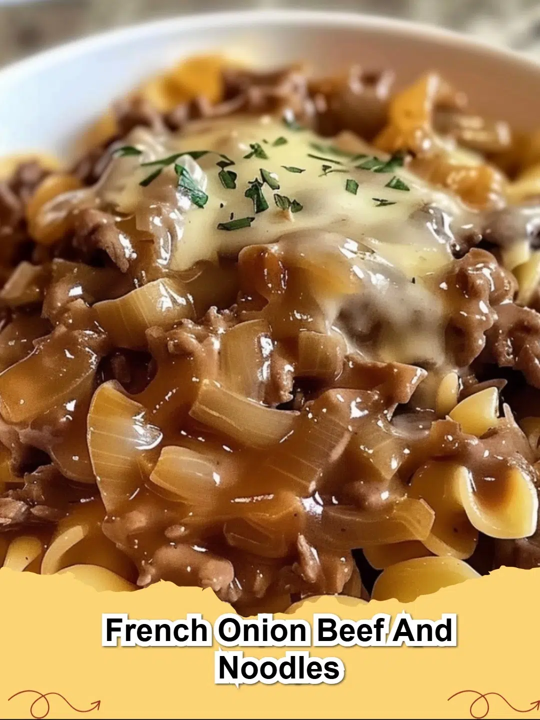 Hearty French Onion Beef and Noodles casserole with melted golden cheese