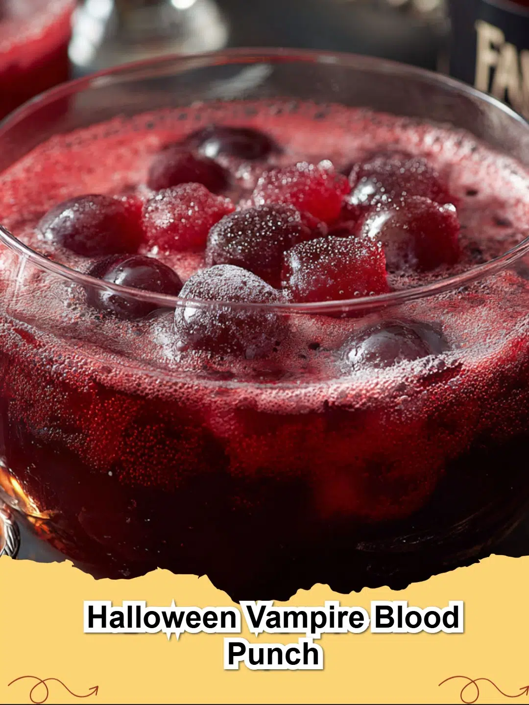 Vibrant red Halloween Vampire Blood Punch in a punch bowl with spooky garnishes