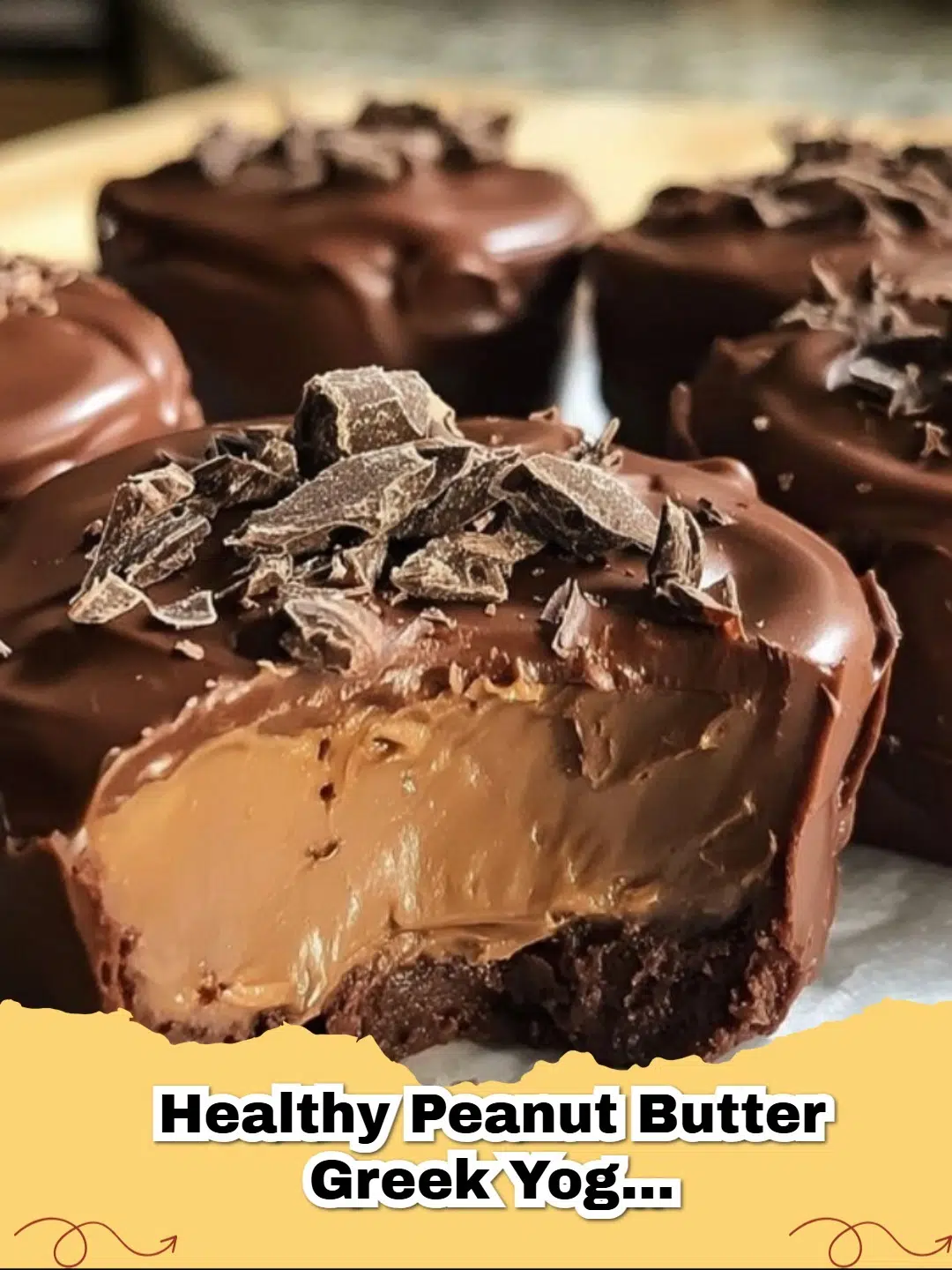 Close-up of Healthy Peanut Butter Greek Yogurt Chocolate Mousse Bites on a plate, garnished with a sprinkle of cocoa powder.