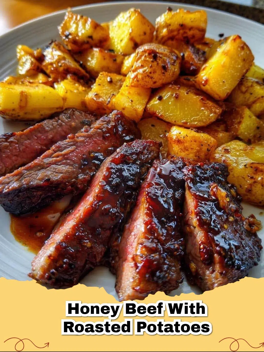Delicious Honey Beef with Roasted Potatoes served on a white plate with fresh parsley garnish.
