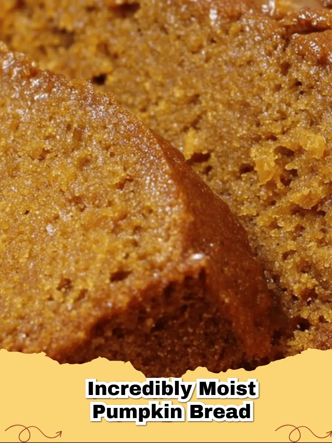 Slice of incredibly moist pumpkin bread with a crumbly topping on a wooden board