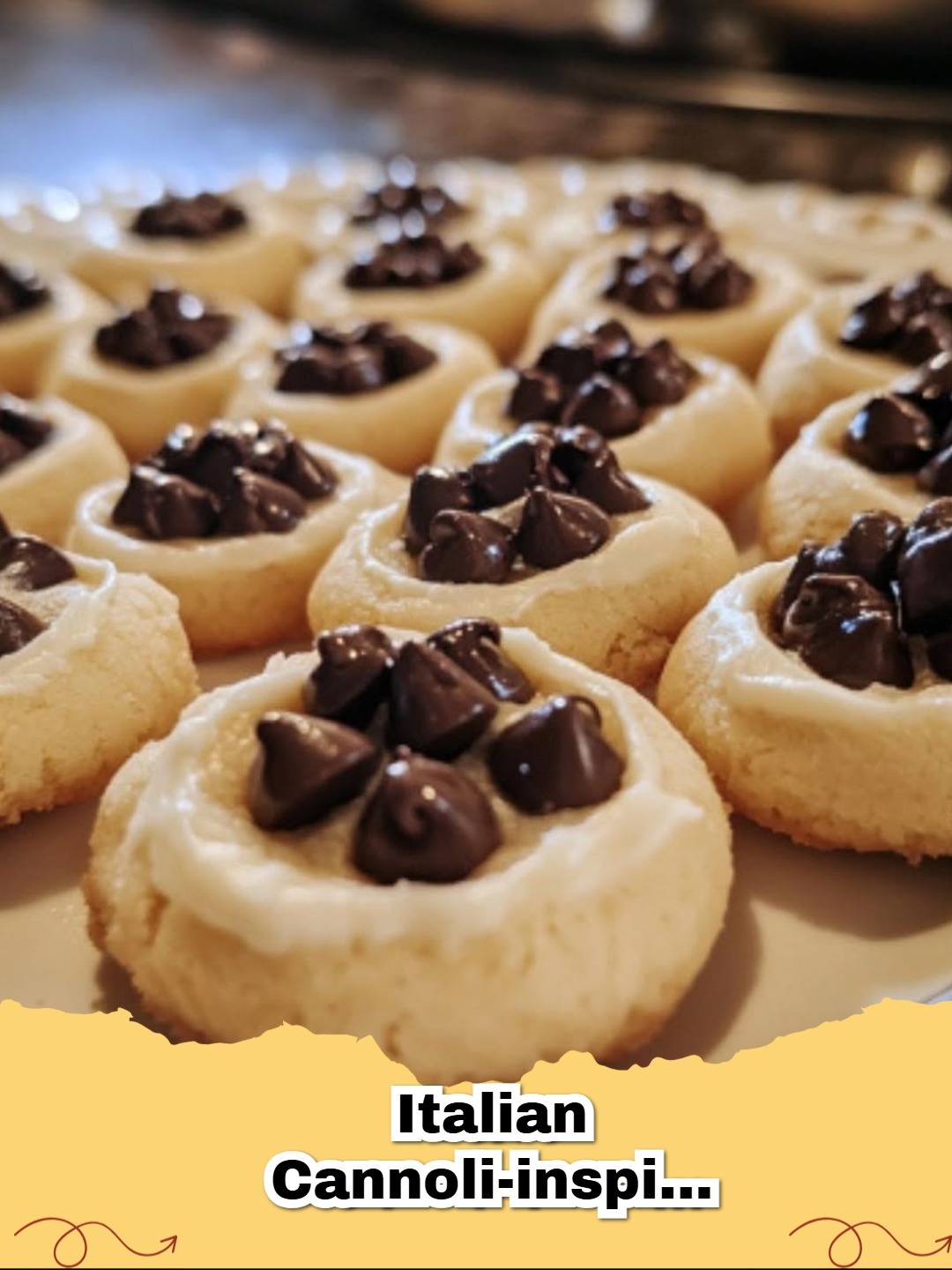 Close-up of freshly baked Italian Cannoli-Inspired Thumbprint Cookies on a cooling rack, showing creamy ricotta filling with chocolate chips and candied fruit.
