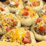 Delicious Loaded Taco Pizza Bombs with creamy queso drizzle and fresh cilantro, perfect for game day.