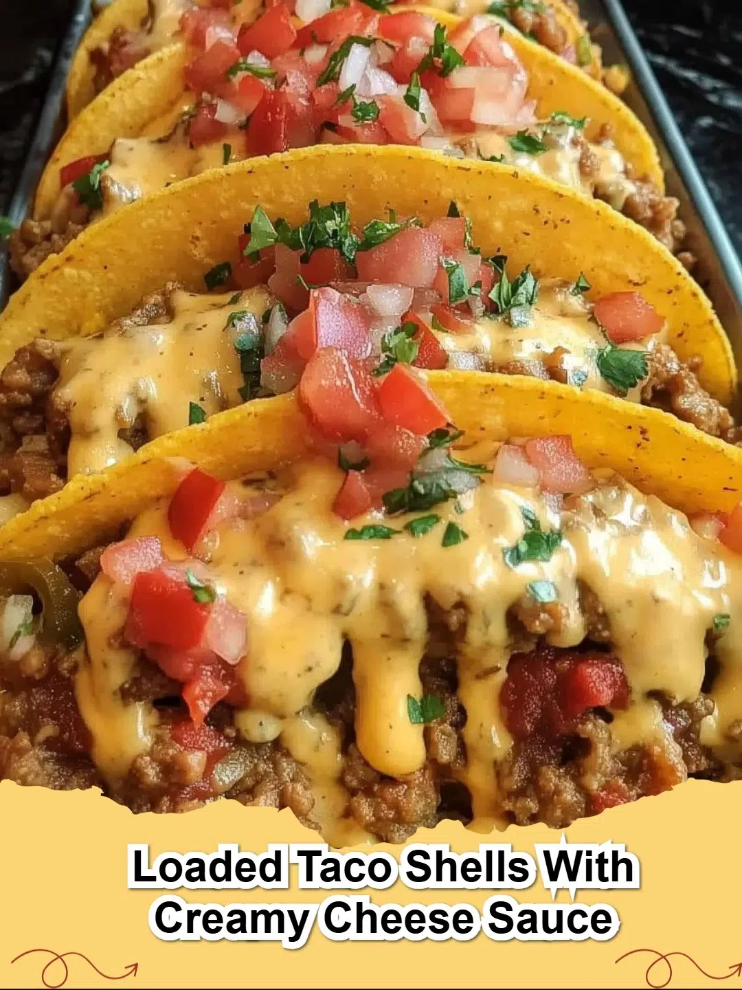 Close-up of three Loaded Taco Shells with Creamy Cheese Sauce, garnished with fresh cilantro and diced tomatoes.