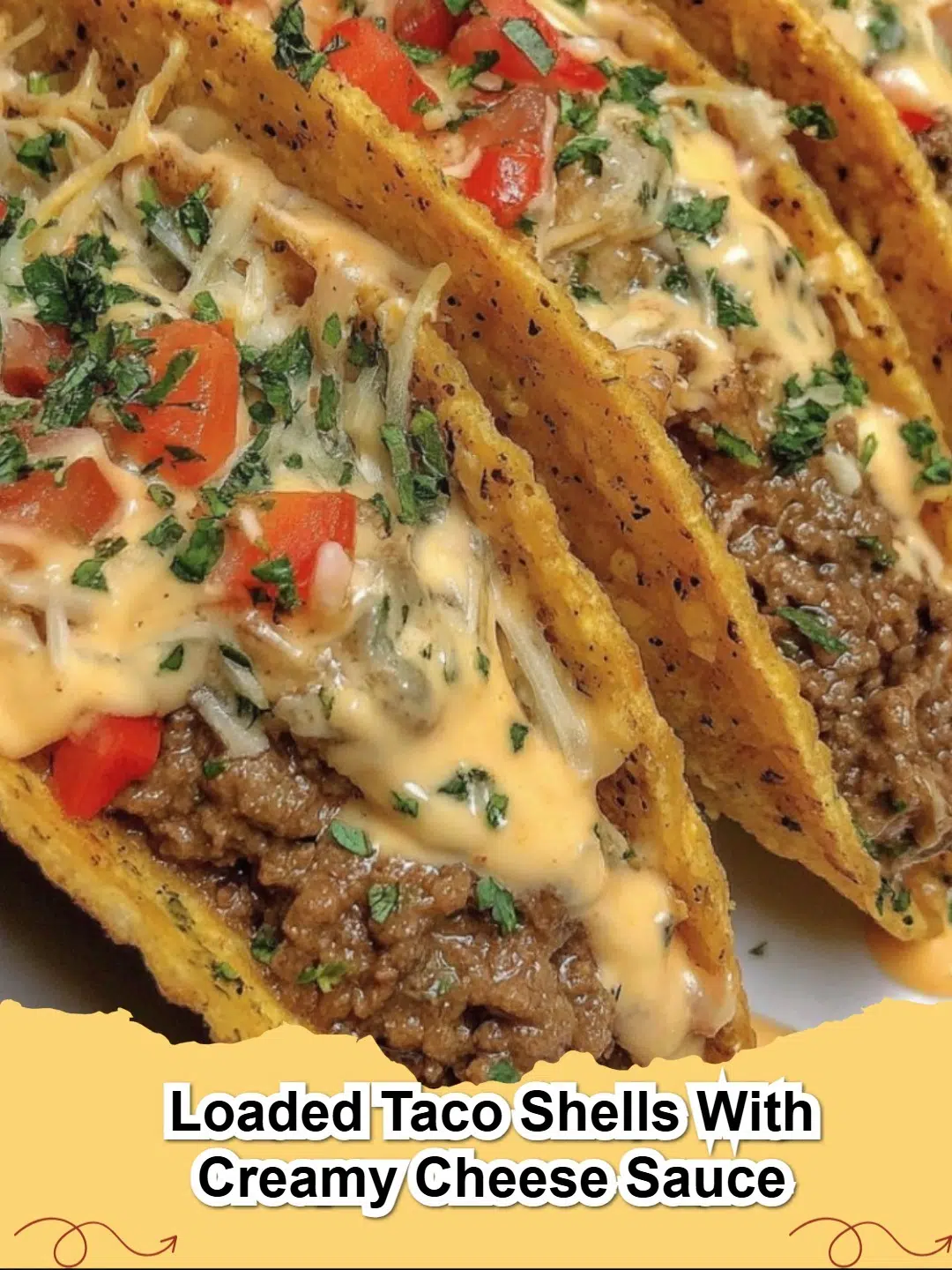 Loaded Taco Shells with Creamy Cheese Sauce, garnished with fresh cilantro and a dollop of sour cream on a wooden board