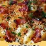 A bubbling cast iron skillet filled with creamy Oktoberfest Bacon Beer Mac & Cheese, topped with crispy bacon bits and green onions, ready to serve.