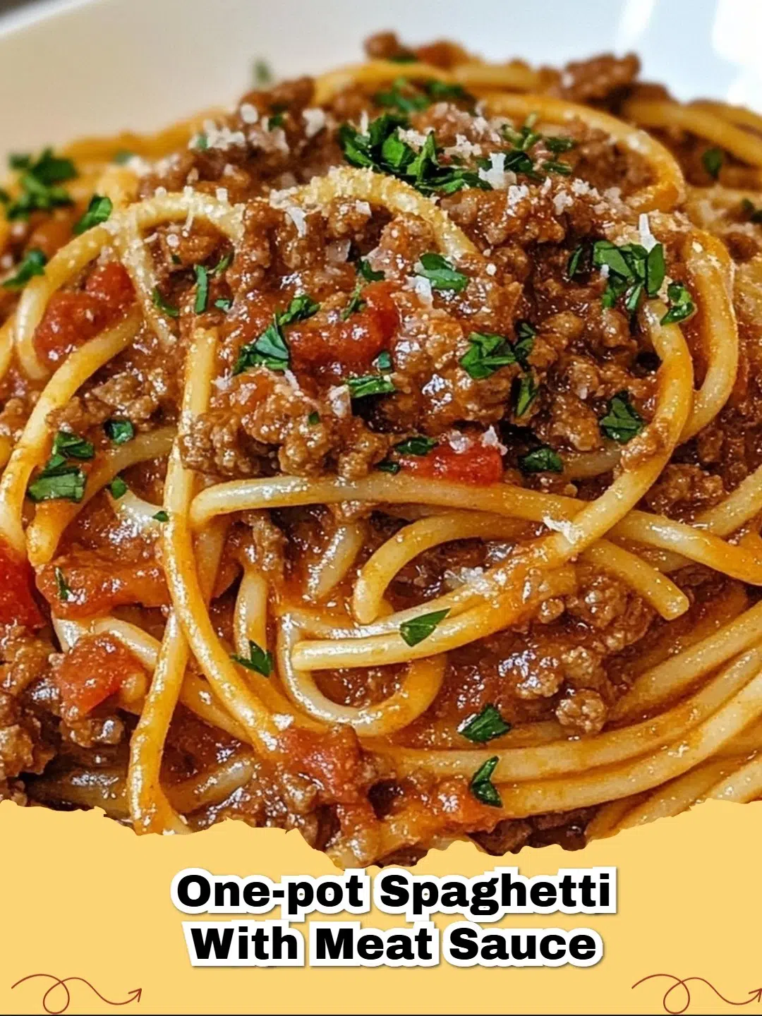 A steaming bowl of delicious One-Pot Spaghetti with Meat Sauce, garnished with fresh parsley and Parmesan.
