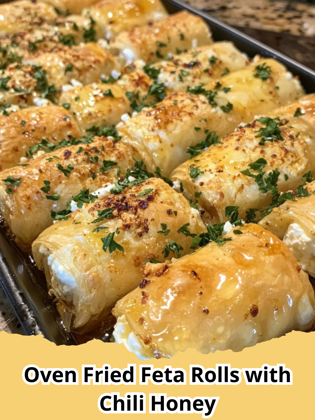 Golden brown Oven Fried Feta Rolls with Chili Honey, garnished with fresh herbs, on a serving platter.