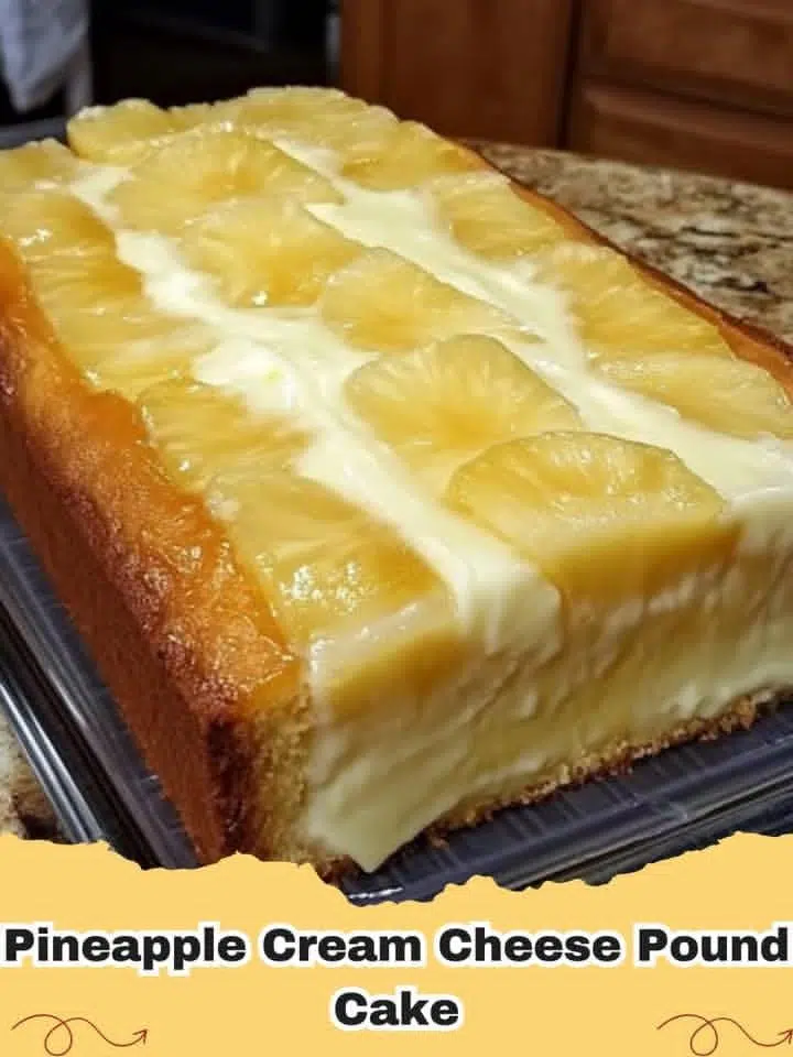 Close-up of a slice of Pineapple Cream Cheese Pound Cake with caramelized pineapple topping on a white plate.