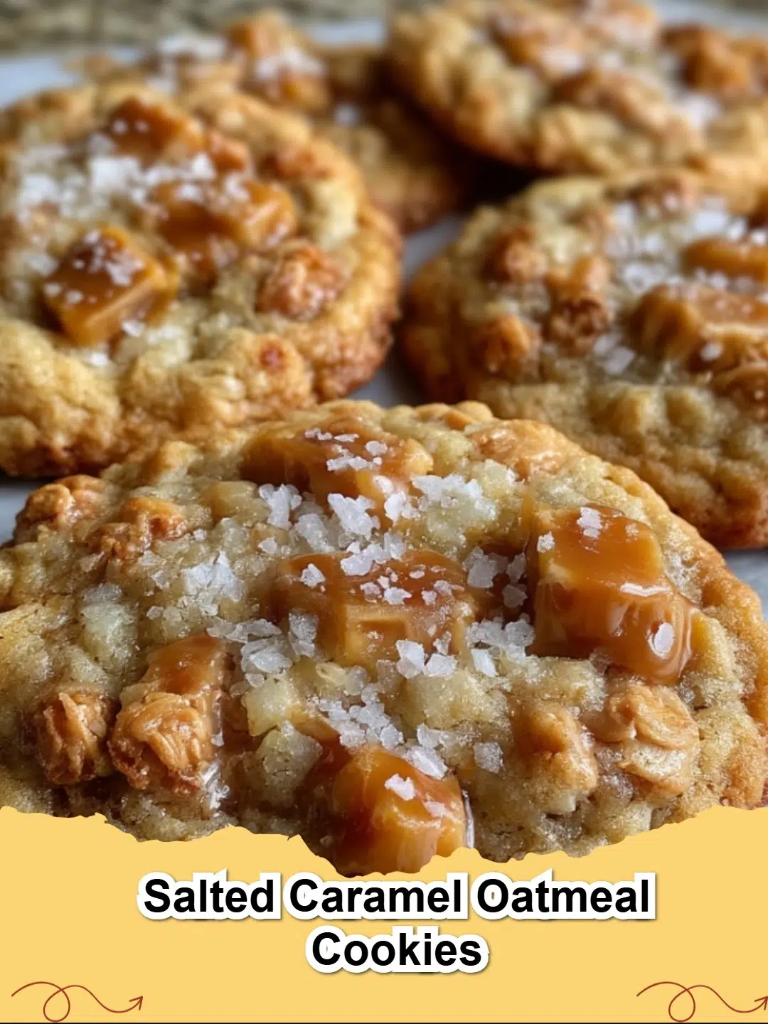 Close-up of freshly baked Salted Caramel Oatmeal Cookies on a cooling rack, sprinkled with sea salt.