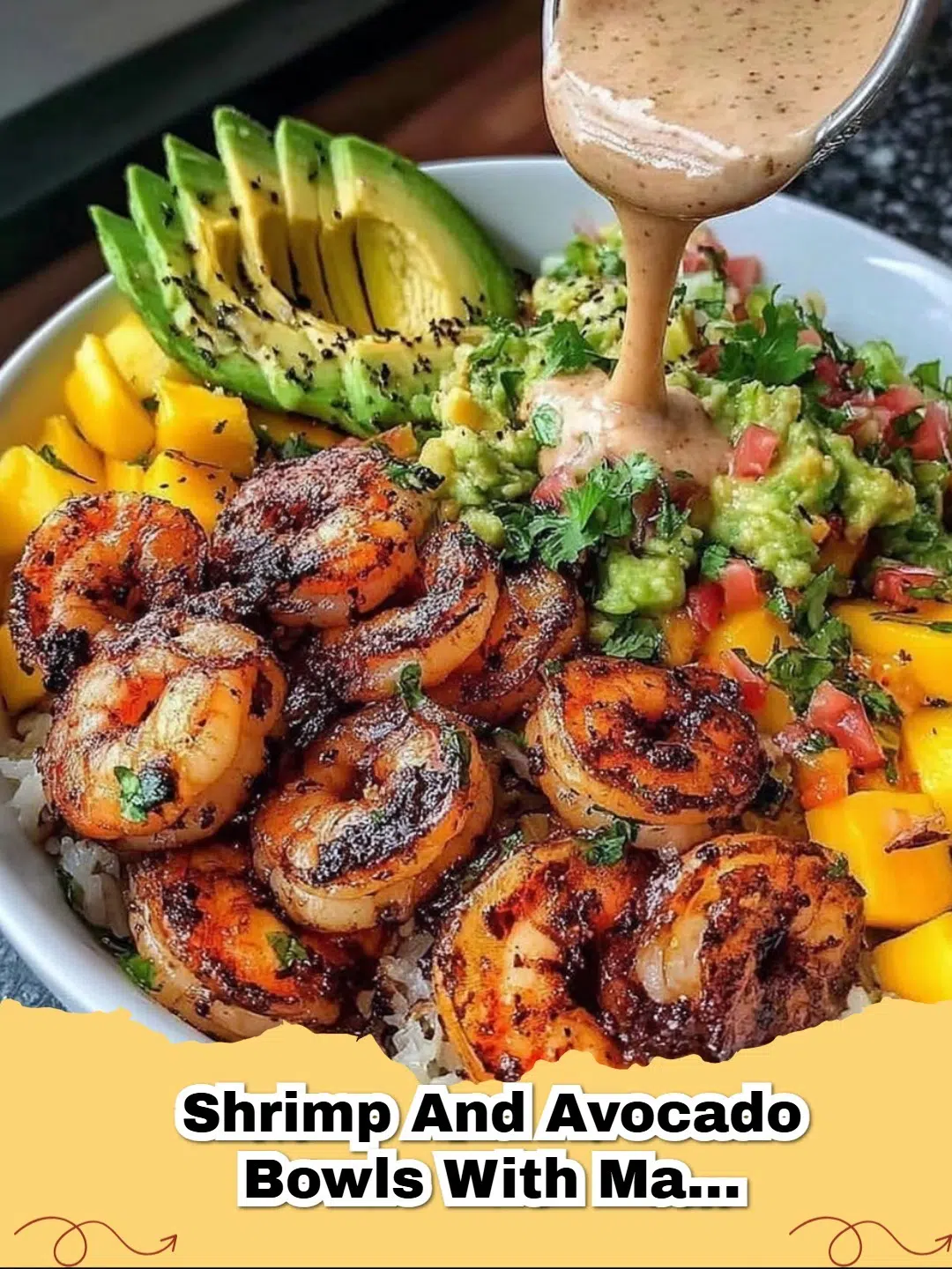 Vibrant Shrimp and Avocado Bowls with Mango Salsa & Lime-Chili Sauce served in white bowls, garnished with fresh cilantro.