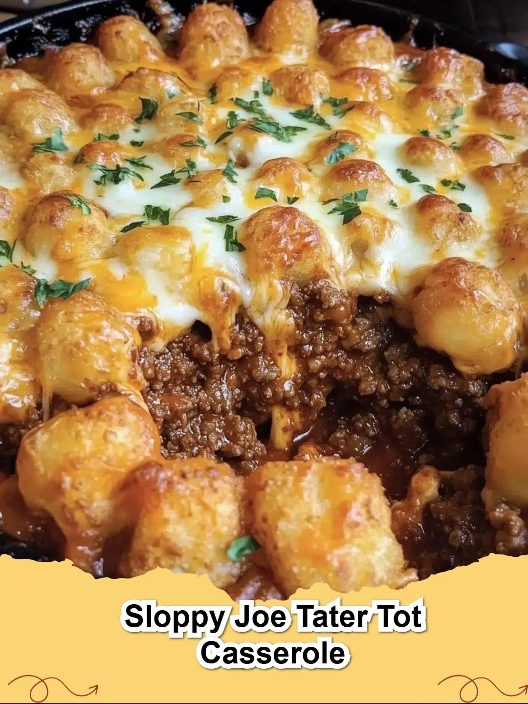 Delicious Sloppy Joe Tater Tot Casserole fresh from the oven, bubbling with cheese and golden tater tots.