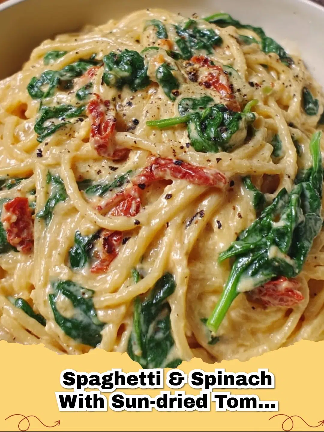 Creamy Spaghetti with Sun-Dried Tomato Cream Sauce and vibrant green spinach
