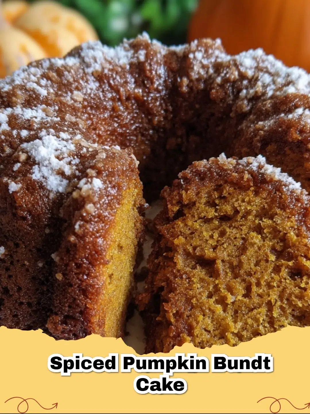 A beautifully baked Spiced Pumpkin Bundt Cake, dusted with powdered sugar, sitting on a rustic wooden board with autumnal decor.