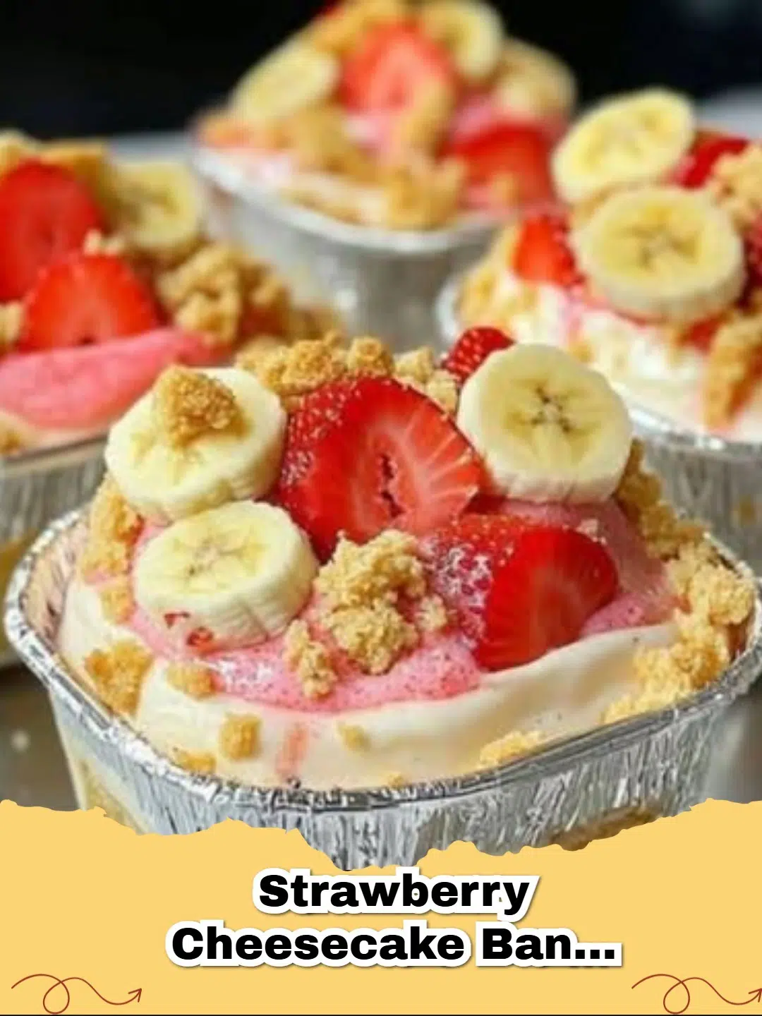 Delicious layers of Strawberry Cheesecake Banana Pudding in a clear dish, topped with fresh strawberries and whipped cream.