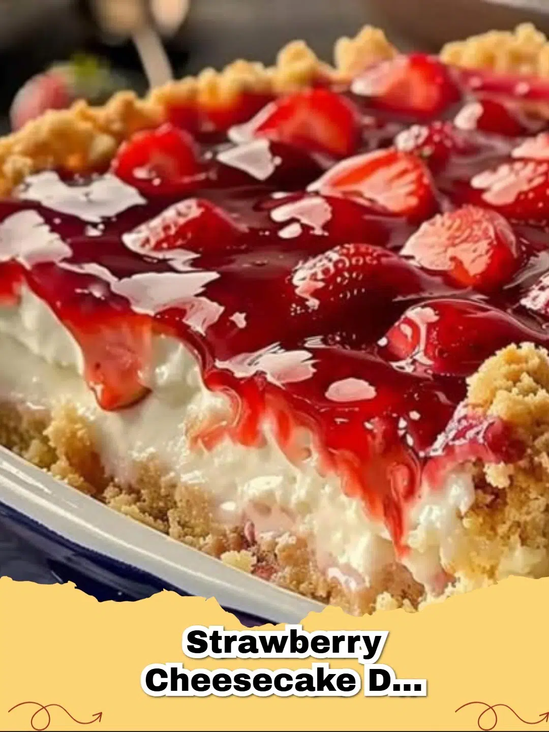Delicious Strawberry Cheesecake Dump Cake in a baking dish, with a scoop removed showing layers of strawberry, cheesecake, and golden cake top.