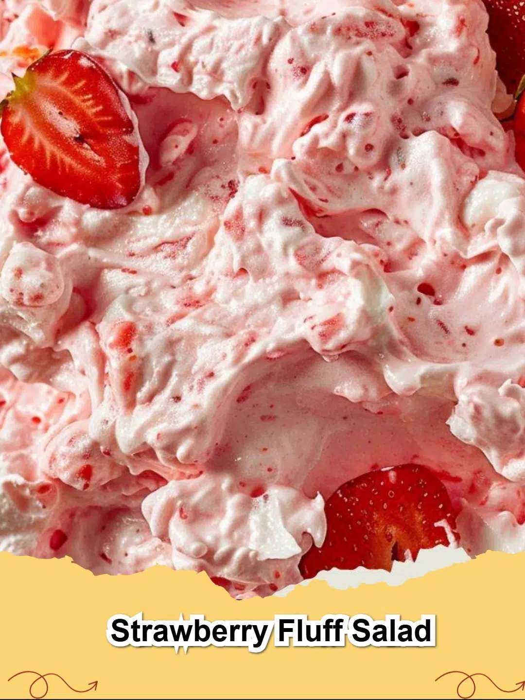 Vibrant Strawberry Fluff Salad in a glass bowl, garnished with fresh strawberries, perfect for a gathering.