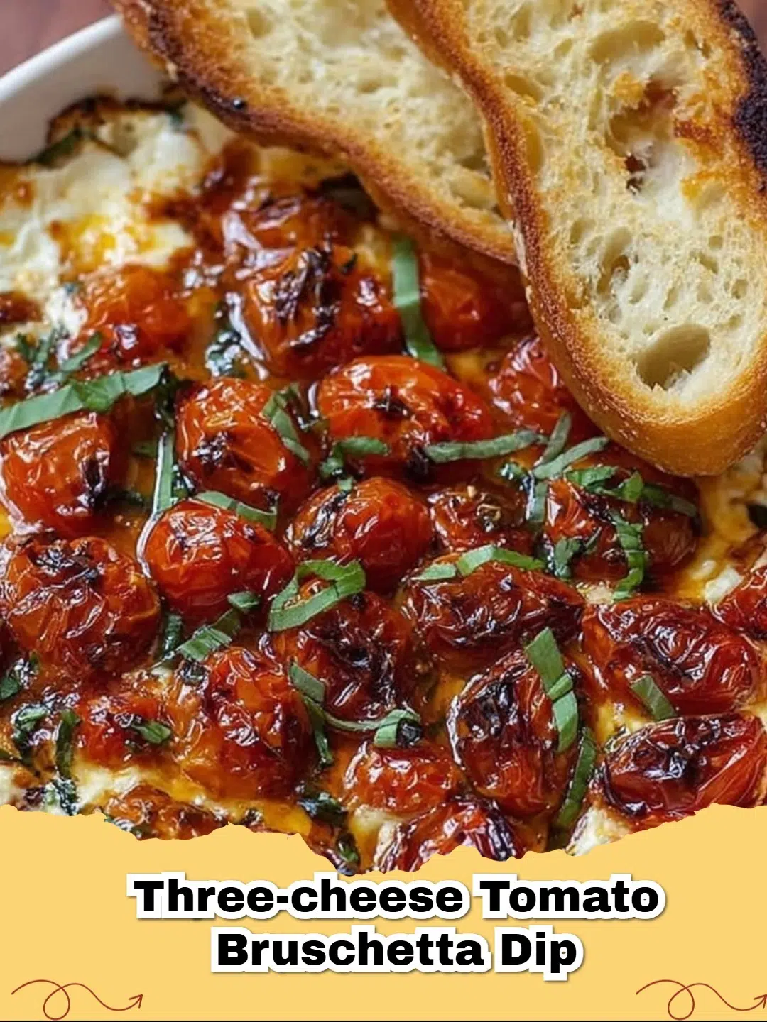 Three-Cheese Tomato Bruschetta Dip bubbling in a baking dish, served with toasted baguette slices