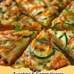 A close-up of a freshly baked Zucchini & Carrot Veggie Pizza, featuring colorful spirals of zucchini and carrots on a cheesy crust.
