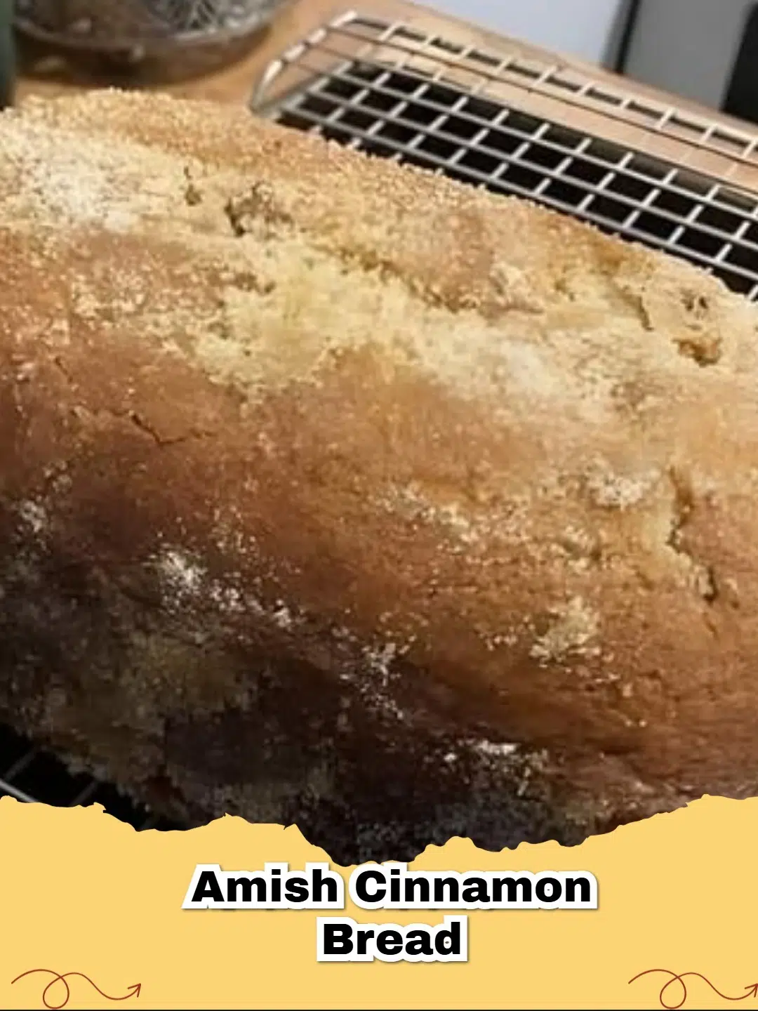 Two loaves of freshly baked Amish Cinnamon Swirl Bread with a visible cinnamon swirl