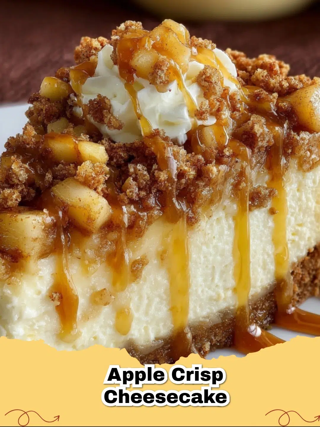 A slice of homemade Apple Crisp Cheesecake with a golden brown oat crisp topping, spiced apple layer, and creamy cheesecake on a graham cracker crust, served on a white plate.