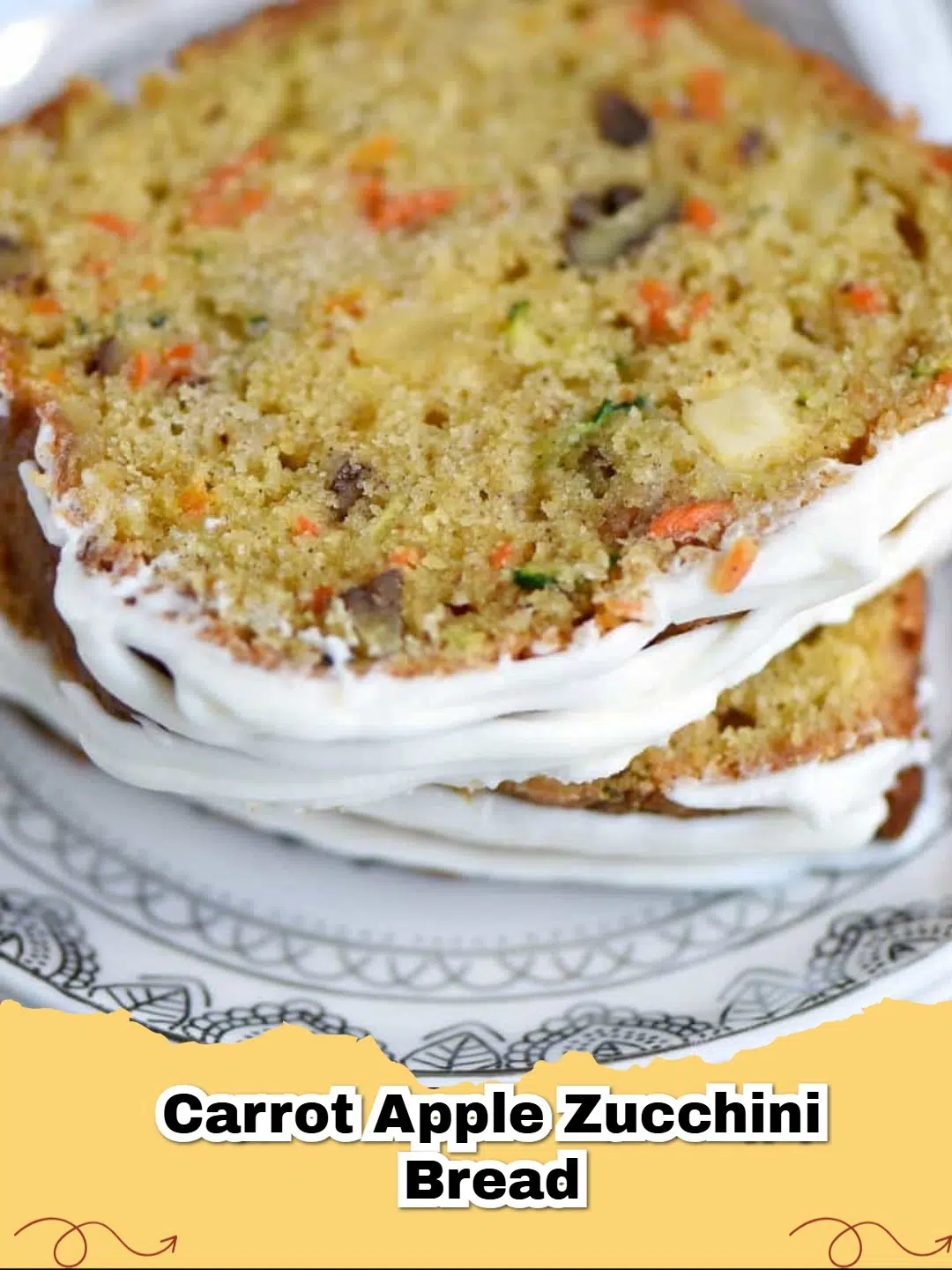 A slice of moist carrot apple zucchini bread with a whole loaf in the background.