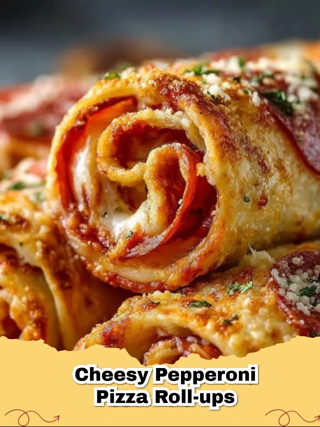 Golden brown Cheesy Pepperoni Pizza Roll-Ups on a baking sheet, with melted cheese and visible pepperoni.