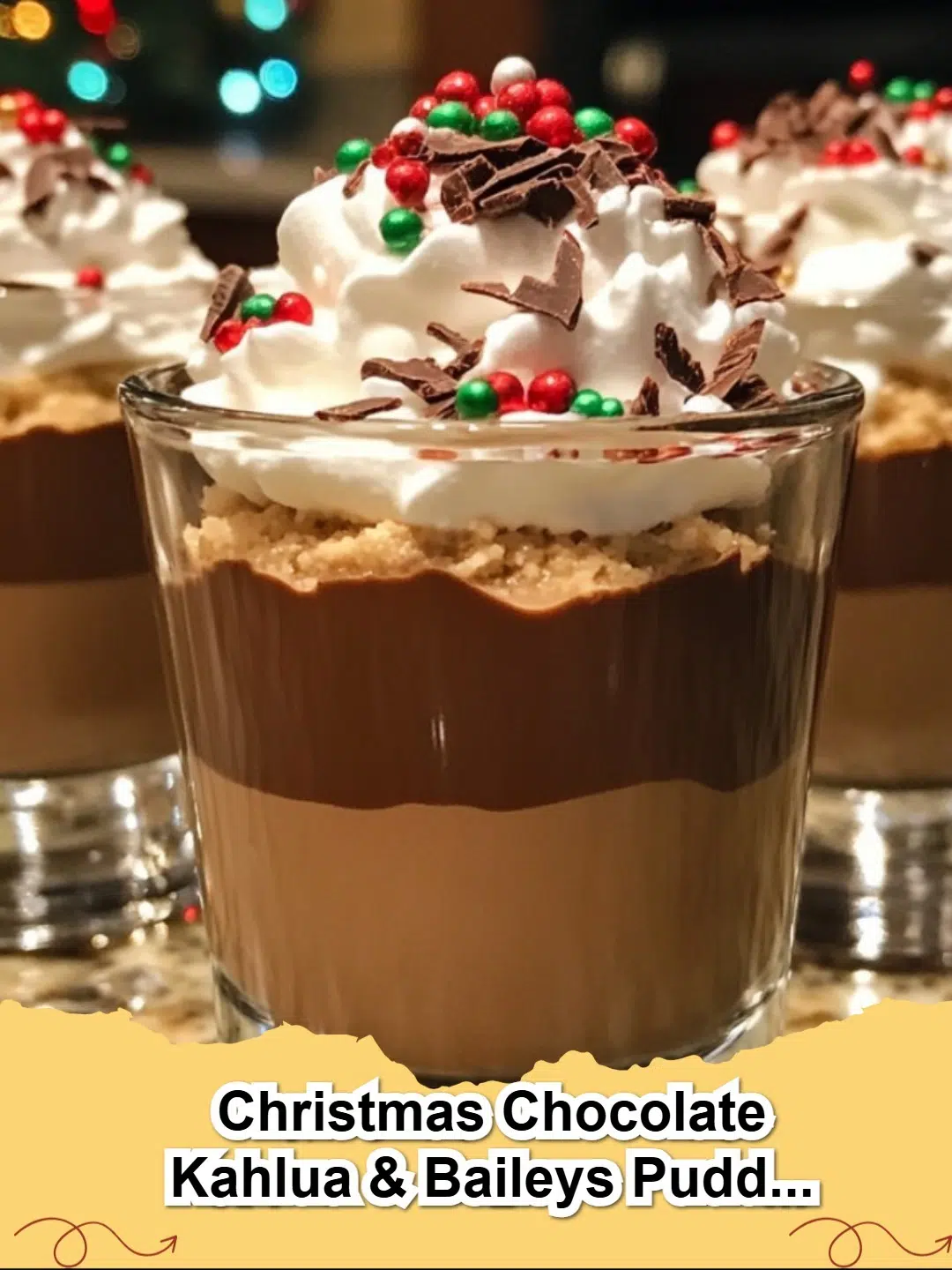 Decadent Christmas Chocolate Kahlua & Baileys Pudding Shots garnished with whipped cream and chocolate shavings, ready for a festive party.