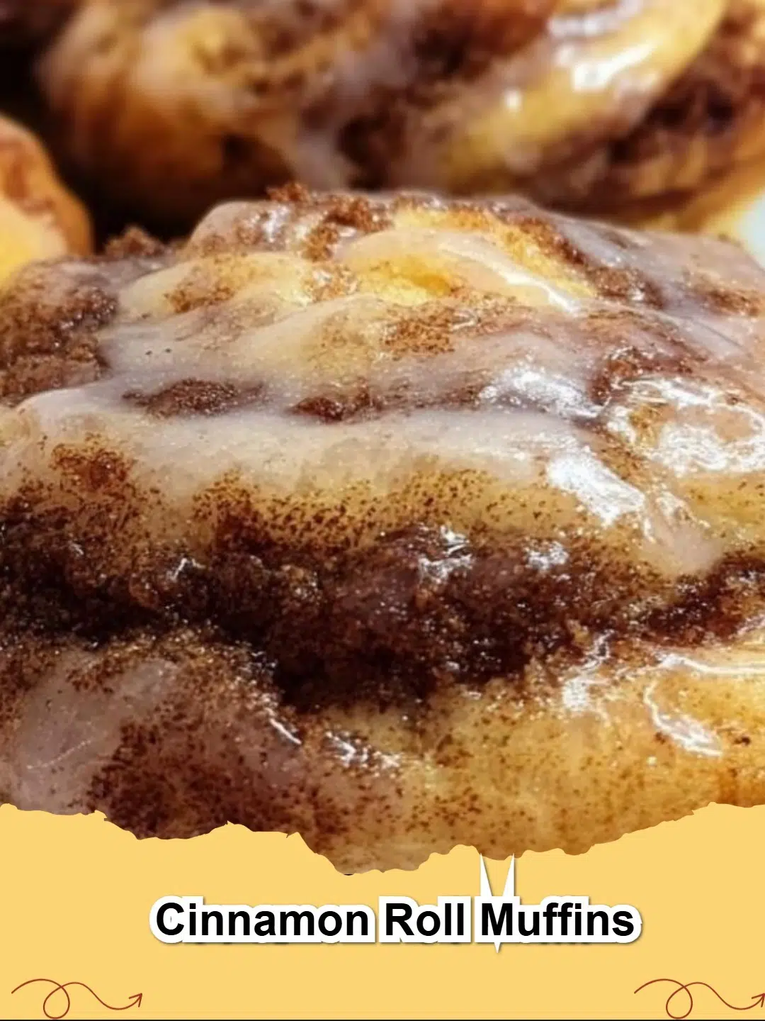 Delicious homemade Cinnamon Roll Muffins drizzled with vanilla glaze, presented on a cooling rack.