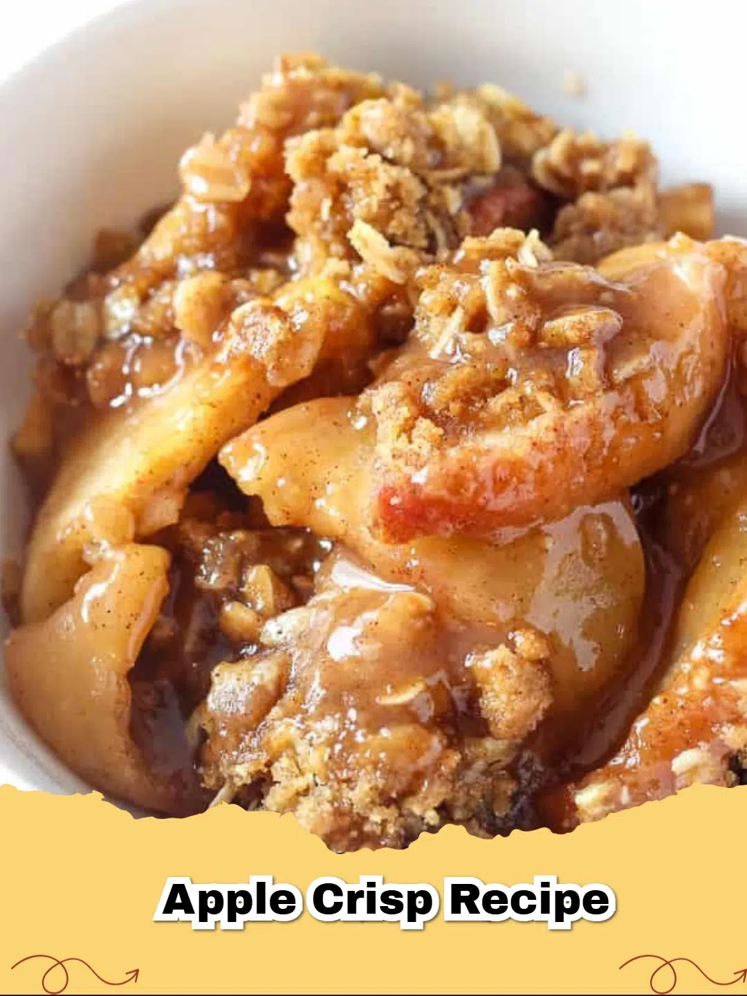 Close-up of a golden brown, bubbly classic apple crisp served warm in a baking dish.