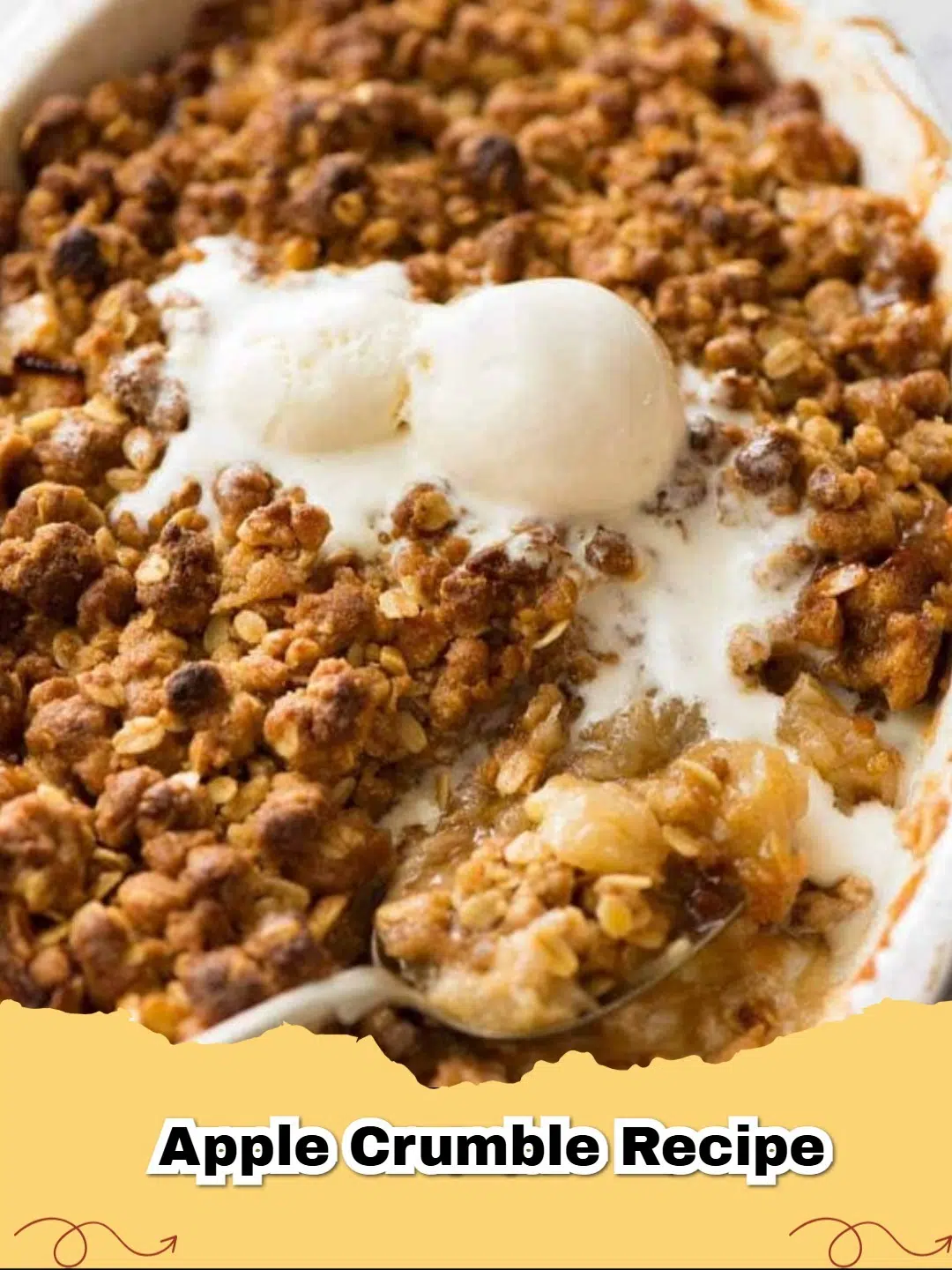 Delicious golden brown classic apple crumble with a scoop of vanilla ice cream