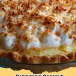 Slice of classic coconut cream meringue pie with a golden meringue topping and creamy coconut filling