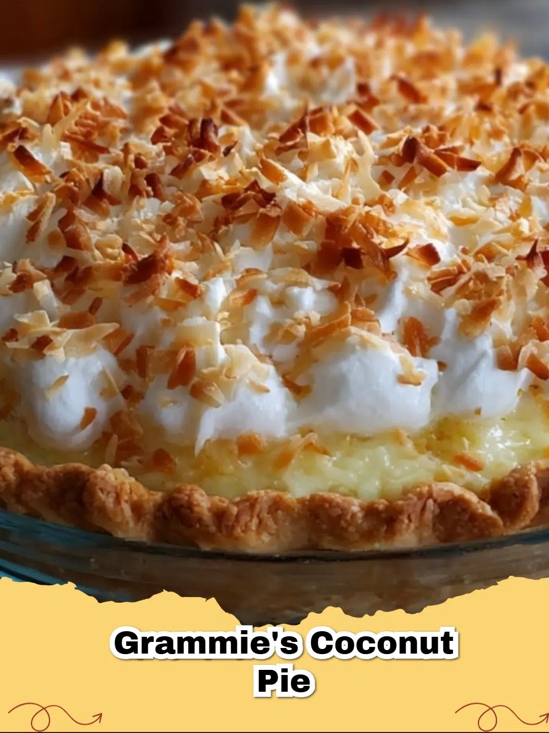 Slice of classic coconut cream meringue pie with a golden meringue topping and creamy coconut filling